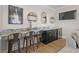 Stylish bar area with marble countertops, seating, and a built-in wine fridge, perfect for entertaining at 5100 Ocean Blvd. N, North Myrtle Beach, SC 29582