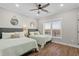 Bedroom with two beds, hardwood floors, and window offering abundant natural light and views at 5100 Ocean Blvd. N, North Myrtle Beach, SC 29582