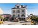 Beautiful exterior elevation of a modern beach house with multiple balconies and ocean views at 5100 Ocean Blvd. N, North Myrtle Beach, SC 29582