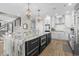 Spacious kitchen featuring a large island with granite countertops, stainless appliances, and ample cabinet space at 5100 Ocean Blvd. N, North Myrtle Beach, SC 29582