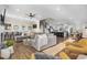 Open-concept living room with a large sectional sofa, modern decor, and access to the kitchen at 5100 Ocean Blvd. N, North Myrtle Beach, SC 29582