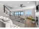 Bright living room with a large sofa, ocean views, and stylish decor, perfect for relaxation at 5100 Ocean Blvd. N, North Myrtle Beach, SC 29582