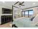 Bedroom featuring ocean views, dark wood furniture, and a ceiling fan at 5100 Ocean Blvd. N, North Myrtle Beach, SC 29582