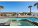 Inviting backyard swimming pool and spa area with ocean views and outdoor dining and lounging at 5100 Ocean Blvd. N, North Myrtle Beach, SC 29582