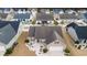 Overhead view of the house highlighting its landscaping, spacious backyard, screened porch, and its neighborhood at 545 Tourmaline Dr., Little River, SC 29566