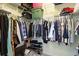 Organized walk-in closet with ample hanging space, shelving, and storage containers at 545 Tourmaline Dr., Little River, SC 29566