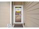 Close-up of front door with decorative wreath and charming exterior siding at 545 Tourmaline Dr., Little River, SC 29566