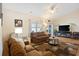 Comfortable living room with cozy furniture, ceiling fan, and natural light at 545 Tourmaline Dr., Little River, SC 29566