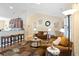 Open-concept living room flows to kitchen, features hardwood floors and neutral decor at 545 Tourmaline Dr., Little River, SC 29566