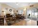 Spacious living room with vaulted ceilings, stylish decor, and sliding door access at 545 Tourmaline Dr., Little River, SC 29566