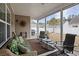 Relaxing screened porch with comfortable seating and views of the backyard at 545 Tourmaline Dr., Little River, SC 29566