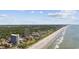 Stunning aerial view of a beach community with ocean views and lush landscaping at 5523 N Ocean Blvd. # 1101, Myrtle Beach, SC 29577