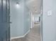Inviting hallway featuring light blue walls, wood floors, and a glimpse of the living area at 5523 N Ocean Blvd. # 1101, Myrtle Beach, SC 29577