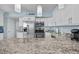 Fully equipped kitchen featuring stainless steel appliances, granite countertops, and stylish fixtures at 5523 N Ocean Blvd. # 1101, Myrtle Beach, SC 29577