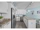 Bright kitchen featuring stainless steel appliances, granite countertops, and ample white cabinetry at 5523 N Ocean Blvd. # 1101, Myrtle Beach, SC 29577