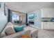 Inviting living room flows into a kitchen with a fireplace and balcony overlooking the ocean at 5523 N Ocean Blvd. # 1101, Myrtle Beach, SC 29577