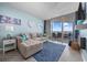 Cozy living room featuring comfortable seating, stylish decor, and stunning ocean views from the balcony at 5523 N Ocean Blvd. # 1101, Myrtle Beach, SC 29577