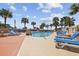 Resort-style pool area with ample lounge chairs and swaying palm trees, perfect for relaxation at 5523 N Ocean Blvd. # 1101, Myrtle Beach, SC 29577