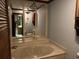 Bathroom featuring large mirror, a tub, and unique hanging light fixtures at 5704 Woodside Ave., Myrtle Beach, SC 29577