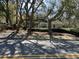 View of a house with trees and shrubbery from the street at 5704 Woodside Ave., Myrtle Beach, SC 29577