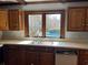 Kitchen sink and countertop with backyard pool views at 5704 Woodside Ave., Myrtle Beach, SC 29577