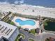 Aerial view showcases a resort pool, beach access, and well-manicured grounds, providing a relaxing getaway at 5905 S Kings Highway # 416-A, Myrtle Beach, SC 29575