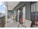 A spacious balcony with seating and sliding glass doors, extending the living space outdoors at 5905 S Kings Highway # 416-A, Myrtle Beach, SC 29575