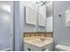 A charming bathroom with a vanity, unique backsplash, and shuttered medicine cabinet, offering both style and functionality at 5905 S Kings Highway # 416-A, Myrtle Beach, SC 29575