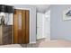 Well-designed bedroom with a wooden closet, closet, and blue accent wall at 5905 S Kings Highway # 416-A, Myrtle Beach, SC 29575