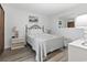 Cozy bedroom with a queen bed and light grey flooring, accentuated by serene wall decor at 5905 S Kings Highway # 416-A, Myrtle Beach, SC 29575