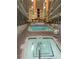 Indoor pool and hot tub area with high ceilings and multiple levels, offering year-round relaxation at 5905 S Kings Highway # 416-A, Myrtle Beach, SC 29575