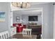 View of living room from the dining area featuring red couches at 5905 S Kings Highway # 416-A, Myrtle Beach, SC 29575
