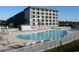 Large outdoor pool with lots of seating at a condo complex near the beach at 5905 S Kings Highway # 416-A, Myrtle Beach, SC 29575