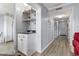Hallway with wet bar that has a sink, storage and open shelves at 5905 S Kings Highway # 416-A, Myrtle Beach, SC 29575