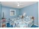A charming bedroom with two twin beds with ocean themed bedding, perfect for vacation living at 5905 S Kings Hwy. # 216B, Myrtle Beach, SC 29577