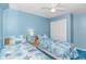 A charming bedroom with two twin beds and overhead fan, perfect for and guest living at 5905 S Kings Hwy. # 216B, Myrtle Beach, SC 29577