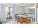 Bright dining area with a view, featuring a light fixture, table set for six, and light wood furniture at 5905 S Kings Hwy. # 216B, Myrtle Beach, SC 29577