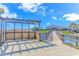 Walkway with pergola and views of the restaurant and waterway leading to the beach at 5905 S Kings Hwy. # 216B, Myrtle Beach, SC 29577