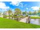 Scenic view of a small wooden bridge crossing a waterway near apartment buildings and tennis courts at 5905 S Kings Hwy. # 216B, Myrtle Beach, SC 29575