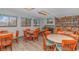 Inviting reading room with cozy tables, chairs, and extensive bookshelves for leisure and study at 5905 S Kings Hwy. # 216B, Myrtle Beach, SC 29577