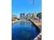 Scenic view of a water feature in front of a condo complex, reflecting a bright blue sky at 5905 S Kings Hwy. # 216B, Myrtle Beach, SC 29575