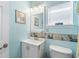 Bright bathroom with seashell trim, sink and toilet at 6001- 1222 S Kings Highway, Myrtle Beach, SC 29575