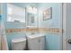 Cozy bathroom with seashell accent wall and white vanity cabinet at 6001- 1222 S Kings Highway, Myrtle Beach, SC 29575