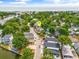 Aerial view of a charming coastal community featuring lush trees and the ocean in the distance, with a pin marking a specific house at 6001 - Mh69B South Kings Hwy., Myrtle Beach, SC 29575