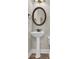 Bathroom with a pedestal sink, modern mirror, and neutral tones at 6001 - Mh69B South Kings Hwy., Myrtle Beach, SC 29575