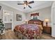 Comfortable bedroom featuring a ceiling fan, wood accents, and a doorway to the attached bathroom at 6001 - Mh69B South Kings Hwy., Myrtle Beach, SC 29575