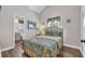 Cozy bedroom featuring a bed, window, and a doorway to an attached bathroom at 6001 - Mh69B South Kings Hwy., Myrtle Beach, SC 29575