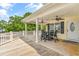 A spacious covered deck with outdoor seating and ceiling fans, perfect for relaxing or entertaining outdoors at 6001 - Mh69B South Kings Hwy., Myrtle Beach, SC 29575