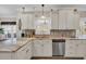 Kitchen with stainless steel dishwasher, tile backsplash, and marbled countertops at 6001 - Mh69B South Kings Hwy., Myrtle Beach, SC 29575