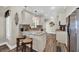 Kitchen with center island seating, tile backsplash, stainless appliances and open floor plan at 6001 - Mh69B South Kings Hwy., Myrtle Beach, SC 29575
